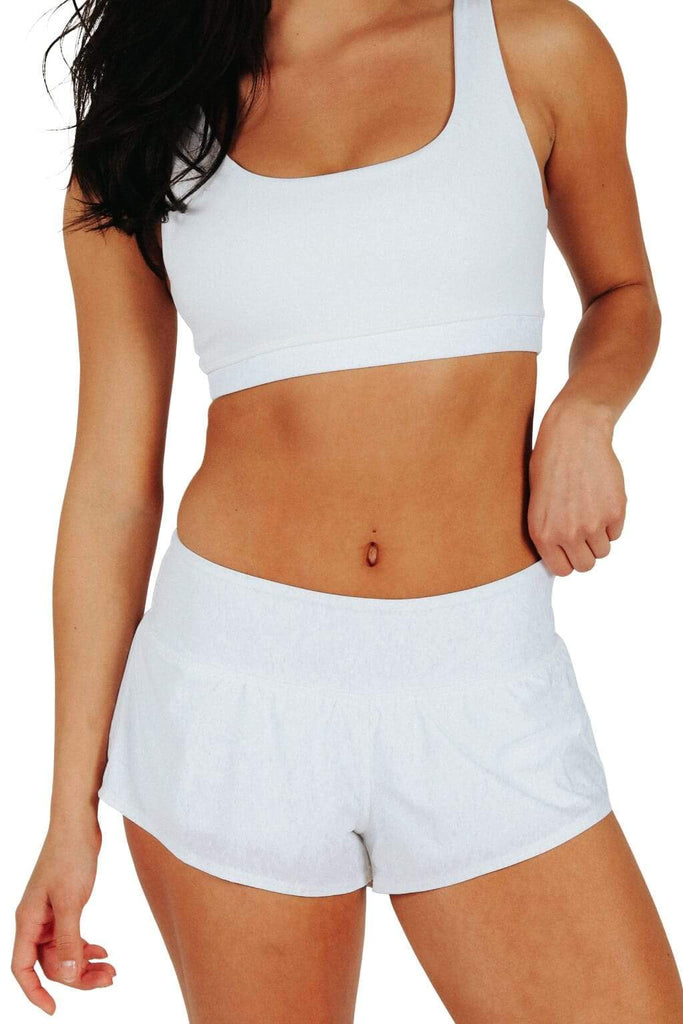 Yoga Democracy women's Eco-friendly activewear Flow Shorts in White color made from post consumer recycled plastic bottles with 3 inch inseam and built-in panty liner. Great running, jogging workout shorts.
