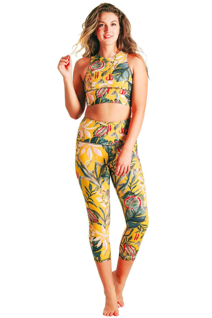 Yoga Democracy Women's Eco-friendly yoga capris crop leggings in Curry Up yellow floral print. USA made from post-consumer recycled plastic bottles. Sweat wicking, anti-microbial, and quick dry ultra-soft brushed fabric.