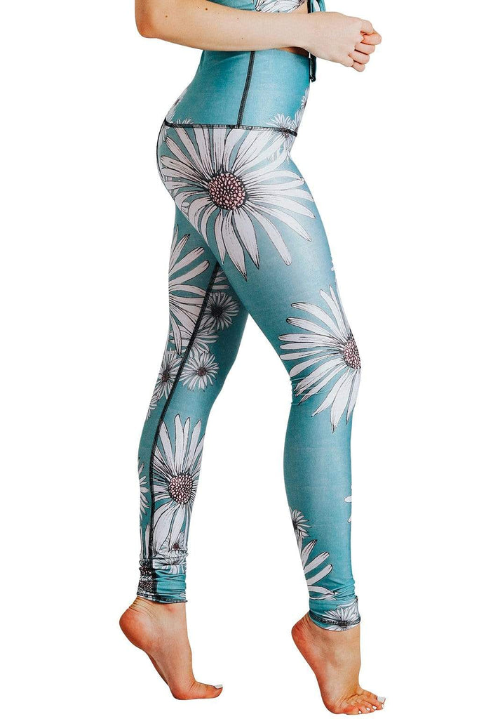 Yoga Democracy Women's Eco-friendly yoga full length leggings in flower child daisy print. USA made from post-consumer recycled plastic bottles. Sweat wicking, anti-microbial, and quick dry ultra-soft brushed fabric.